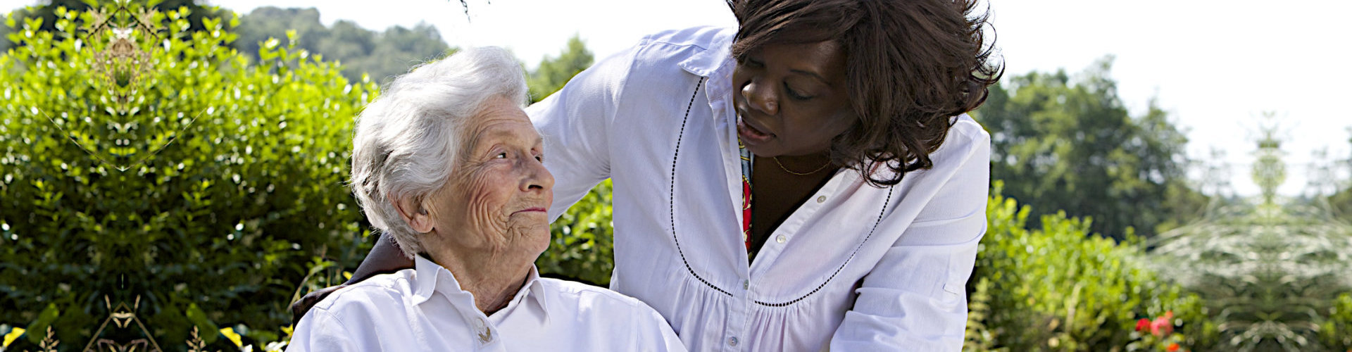 senior woman and adult woman looking at each other